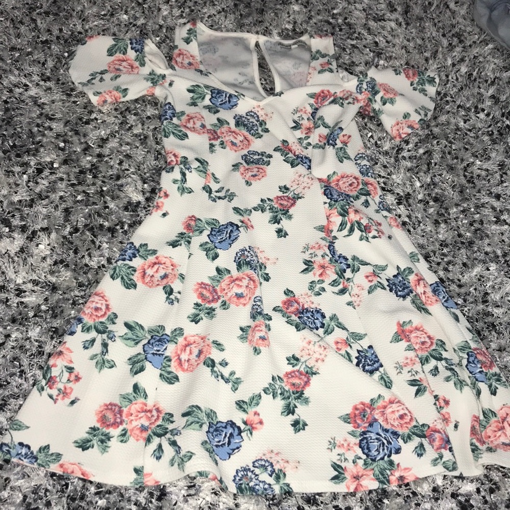 a white and floral dress.